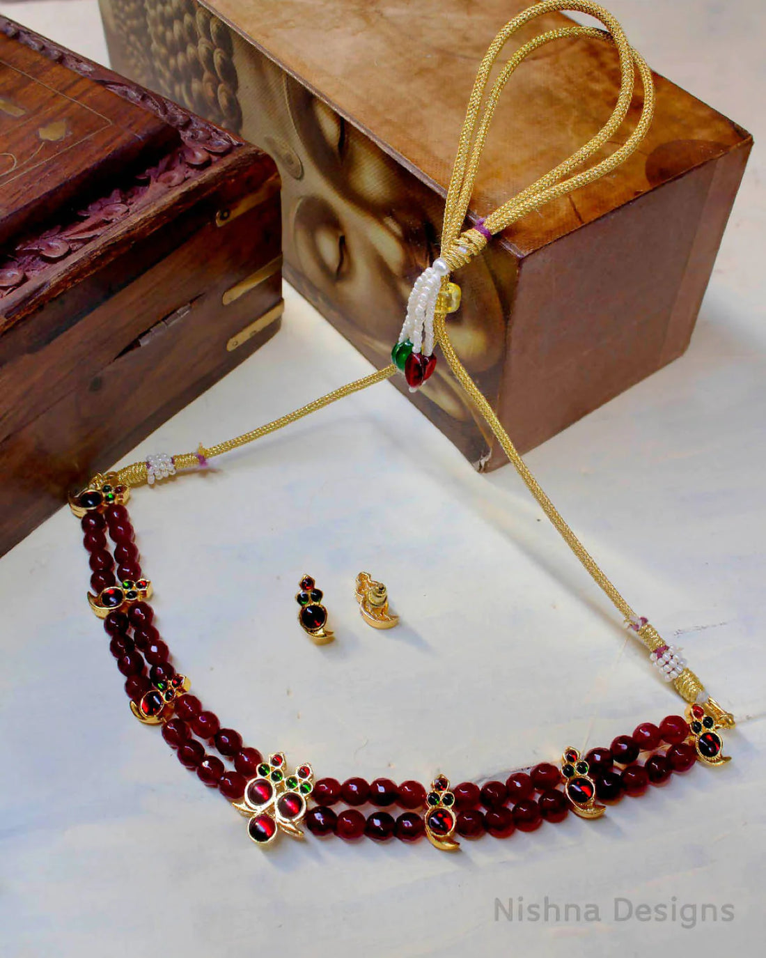 legance Redefined: The Allure of Two Layer Maroon Agate Beads Kemp Gold Mango Motif Choker Set