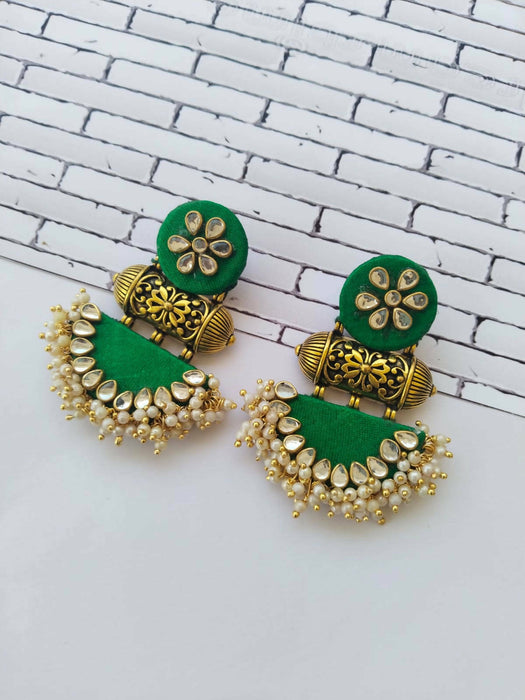 Green kundan with semi circle earrings