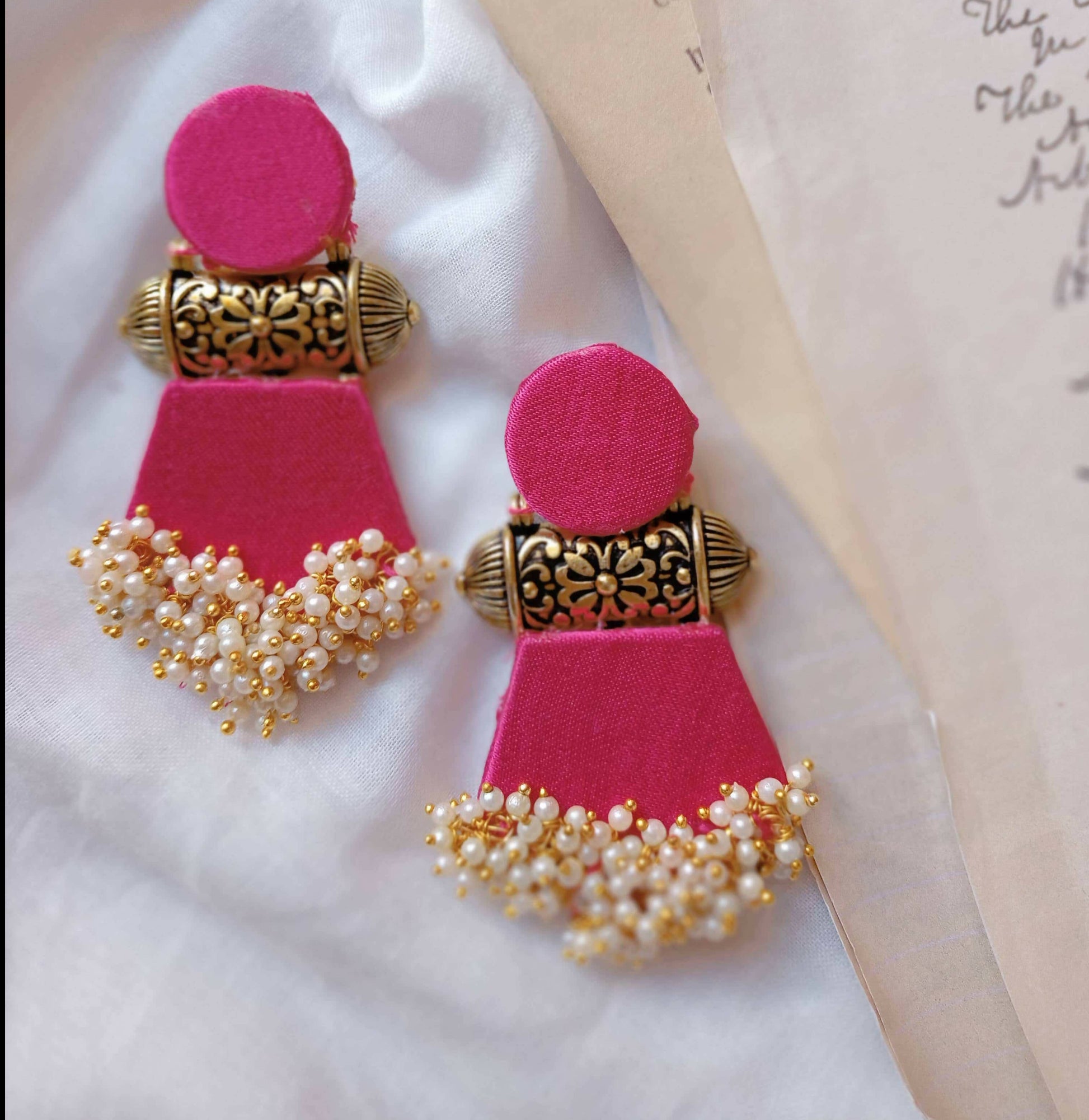 pink and gold jhumka earrings