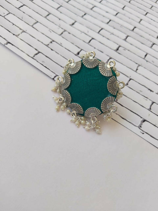 Green and silver circle finger ring