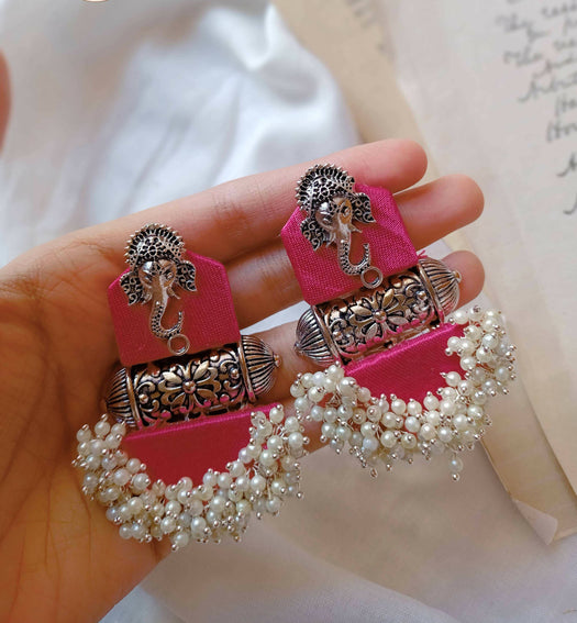 Pink and silver earrings with white beads