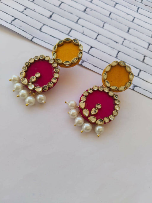 pink and yellow earrings