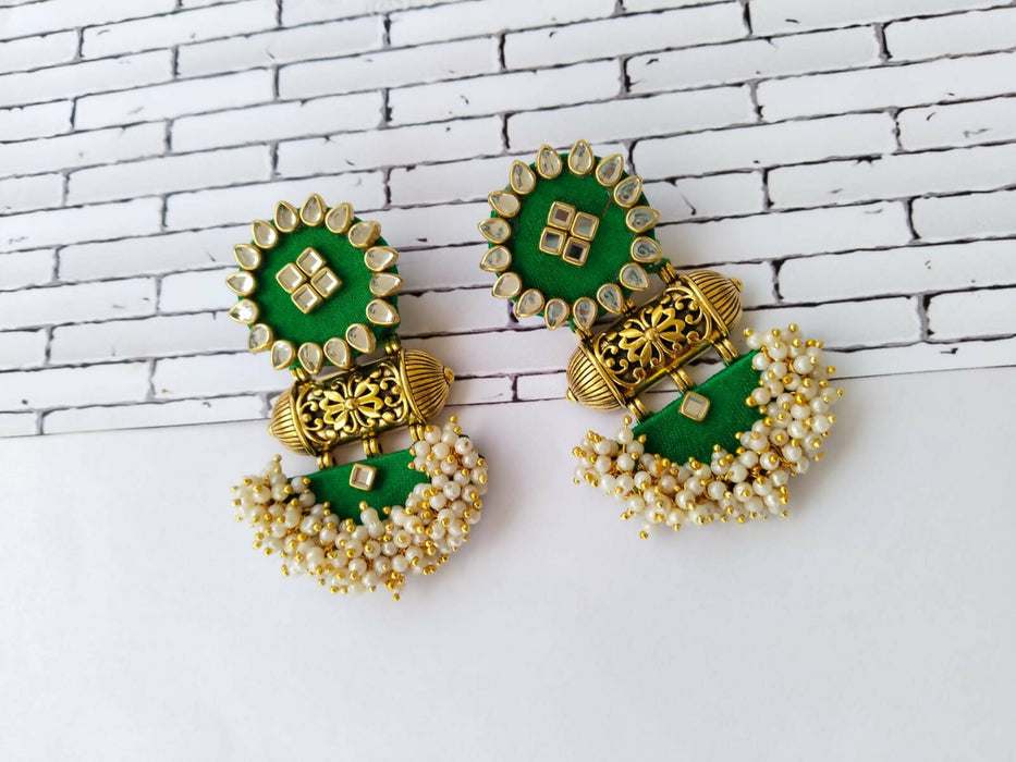 Green heavy studded earrings