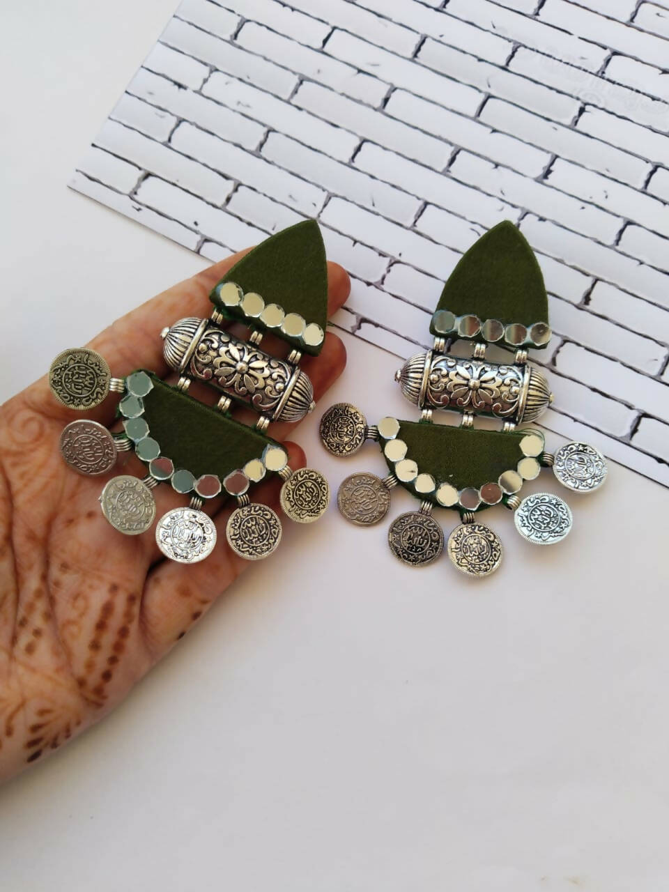 green jhumka earrings
